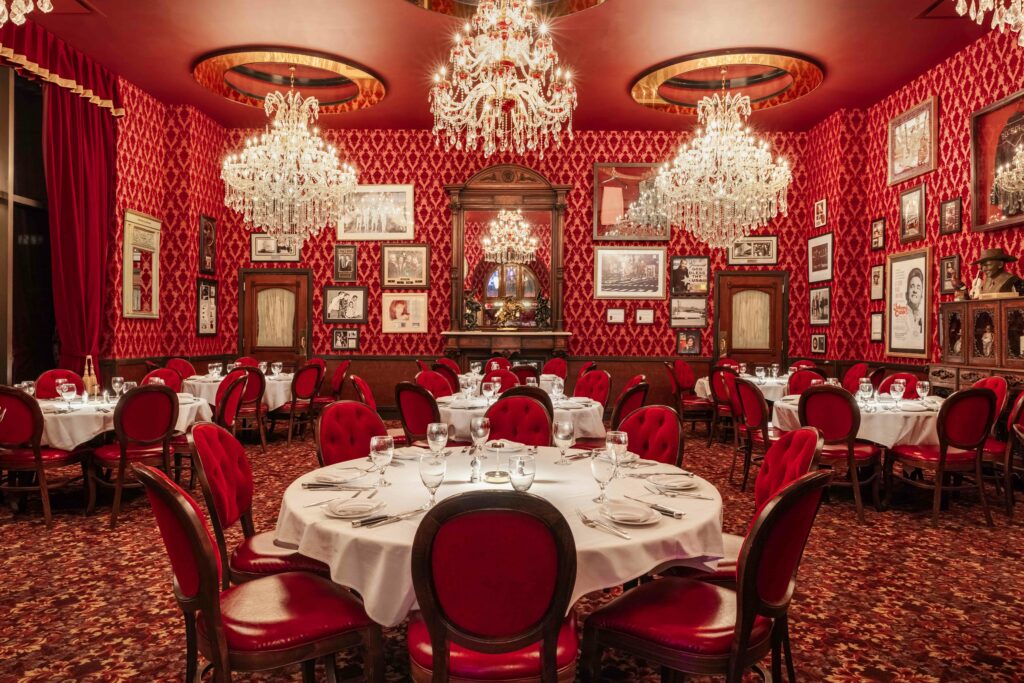 red dining room prepared to serve guests